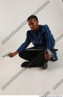 04 2018 01 GARSON SITTING POSE WITH GUNS